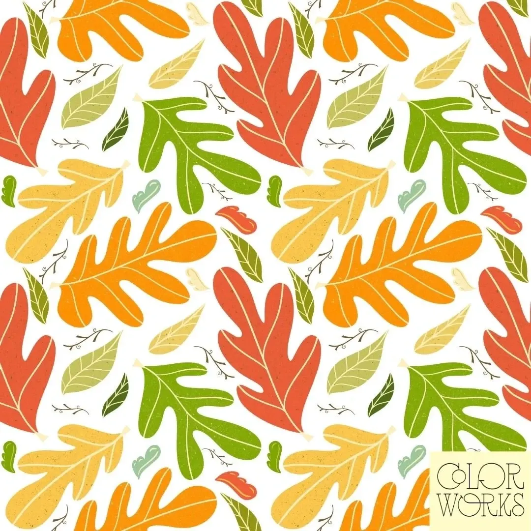 Orange, yellow, and green leaf sprays on cream.